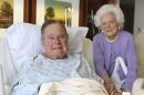 In this photo provided by Office of George H.W. Bush on Monday Jan. 23, 2017, former President George H.W. Bush and his wife Barbara pose for a photo at Houston Methodist Hospital in Houston. The 92-year-old former president is still suffering from pneumonia, but is well enough to leave the intensive care unit at a Houston hospital, doctors said Monday. His wife, Barbara, has been discharged from the same facility after completing treatment for bronchitis. (Courtesy the Office of George H.W. Bush via AP)