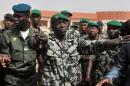 This photo taken on March 29, 2012, shows Malian military junta leader Amadou Sanogo (C) arriving at the airport in Bamako