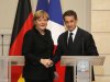 German Chancellor Angela Merkel, left, and France's President Nicolas Sarkozy, right, shake hands at the end of their joint news conference at the Elysee Palace, Paris, Monday, Dec. 5, 2011. Sarkozy and Merkel sought Monday to present a unified plan to tighten oversight of government budgets - a key step ahead of a European Union summit later this week to try to save the euro. (AP Photo/Michel Euler)