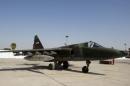 The Sukhoi Su-25 aircraft is seen loaded with bombers at an air base in Baghdad