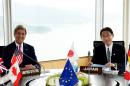 US Secretary of State John Kerry (L) and Japan's Foreign Minister Fumio Kishida pose during the first session of the G7 Foreign Ministers' Meeting in Hiroshima on April 10, 2016