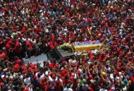 The coffin of Venezuela's late President Hugo Chavez is driven through the streets of Caracas after leaving the military hospital where he died of cancer in Caracas, March 6, 2013. REUTERS/Jorge Dan Lopez