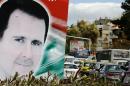 A photo taken on March 4, 2015 shows a banner bearing a portrait of Syrian President Bashar al-Assad in a street in the city of Damascus