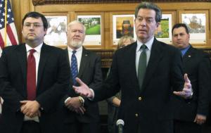 Kansas Gov. Sam Brownback answers questions from reporters&nbsp;&hellip;