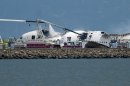 A fire truck sprays water on Asiana Flight 214 after it crashed at San Francisco International Airport on Saturday, July 6, 2013, in San Francisco. (AP Photo/Noah Berger)