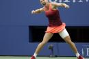 Simona Halep, of Romania, reacts after beating Victoria Azarenka, of Belarus, during a quarterfinal match at the U.S. Open tennis tournament, Wednesday, Sept. 9, 2015, in New York. (AP Photo/Seth Wenig)