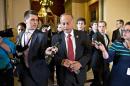 FILE - In this Oct. 15, 2013 file photo, Rep. Steve King, R-Iowa, walks from House Speaker John Boehner's office with reporters in pursuit on Capitol Hill in Washington. King, a chief Republican foe of immigration legislation says it would be a 