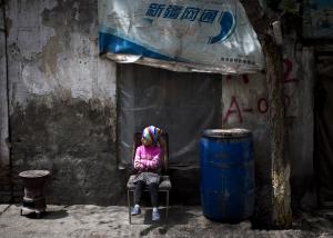 An ethnic Uighur child sits on a broken chair while&nbsp;&hellip;