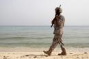 A Saudi border guard patrols near Saudi Arabia's border with Yemen, along beach on Red Sea, near Jizan