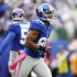 New York Giants wide receiver Victor Cruz (80) celebrates after catching his third touchdown pass of the game during the second half of an NFL football game against the Cleveland Browns Sunday, Oct. 7, 2012, in East Rutherford, N.J. (AP Photo/Julio Cortez)