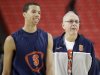 Syracuse's Michael Carter-Williams walks on the court with Syracuse head coach Jim Boeheim during practice the NCAA Final Four tournament college basketball semifinal game against Michigan, Friday, April 5, 2013, in Atlanta. Syracuse plays Michigan in a semifinal game on Saturday. (AP Photo/David J. Phillip)