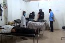 Image taken from a YouTube video shows a UN inspectors visiting a hospital in the Damascus suburb of Moadamiyet al-Sham
