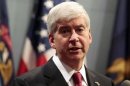 Michigan Governor Rick Snyder holds a news conference to talk about why he signed into law right-to-work laws in Lansing, Michigan