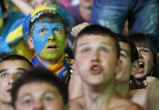 Fans of Ukraine react during a public screening of the Euro 2012 Group B soccer match between Ukraine and England in the fan zone in Kiev