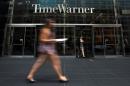 A woman walks past the Time Warner Center near Columbus Circle in Manhattan, New York