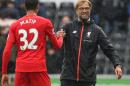 Liverpool's manager Jurgen Klopp (R) congratulates defender Joel Matip at the end of their English Premier League match against Swansea City, at The Liberty Stadium in Swansea, south Wales, on October 1, 2016