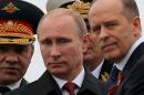 File photo of Russian President Putin, Defence Minister Shoigu and FSB Director Bortnikov watching events to mark Victory Day in Sevastopol