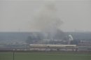 Smoke rises during what activists say is fighting between forces loyal to Syria's President Assad and Free Syrian Army fighters, in a military area in Binsh near Idlib, in this picture provided by Shaam News Network