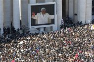 Pope Benedict XVI appears on a giant screen in a packed Saint Peter's Square at the Vatican during his last general audience, February 27, 2013. REUTERS/Stefano Rellandini