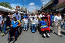 Opposition supporters on wheelchairs take part in a demostration to demand to the National Election Council the acceleration of the process of a recall referendum against President Nicolas Maduro, in Caracas