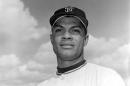 In this March 8, 1962 file photo Felipe Alou, outfielder for the San Francisco Giants, poses in Casa Grande, Ariz. Alou and Orlando Cepeda were dark-skinned Latinos who knew little English when they arrived in the minor leagues as teenagers, among the first wave of Spanish-speaking players thrown into a new culture to play professional baseball. Both are encouraged to see so many young players from Latin America now arriving in the U.S. with better English skills, thanks in large part to all 30 major league organizations putting more emphasis into such training through academies in the Dominican Republic and Venezuela. (AP Photo/File)