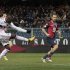 AC Milan's Balotelli shoots to score a second goal against Genoa during their Italian Serie A soccer match in Genoa