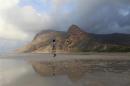 A local guide walks on the approach to Ditwa lagoon and beach near the port of Qalensiya, the second biggest town on Yemen's Socotra island