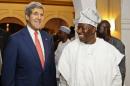 Nigeria's President, Goodluck Jonathan, right, walks with U.S. Secretary of State, John Kerry, on his arrival at the State House in Lagos, Nigeria, Sunday, Jan. 25, 2015. In a rare high-level visit to Africa's most populous country, U.S. Secretary of State John Kerry on Sunday urged Nigeria's leading presidential candidates to refrain from fomenting violence after next month's vote, and he condemned savage attacks by Boko Haram, an al-Qaida-linked insurgency. (AP Photo/Akintunde Akinleye, Pool)