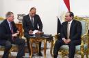 In this photo provided by Egypt's state news agency, MENA, Egyptian President Abdel-Fattah el-Sissi, right meets with Republican Sen. Lindsey Graham, left, at the office of the Presidency in Cairo, Egypt. On Sunday, Graham told reporters in Cairo, that Republican candidate Donald Trump's campaign does not mean that the U.S. has 