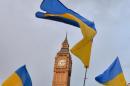 Ukrainian flags are pictured in London's Parliament Square on March 3, 2014, during a demonstration against Russia's involvement in the crisis in Ukraine