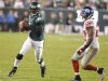 Eagles quarterback Vick scrambles for a gain during fourth quarter of NFL game in Philadelphia
