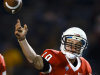 Ball State quarterback Keith Wenning asses the ball against Toledo during the first quarter of an NCAA college football game in Toledo, Ohio, Tuesday, Nov. 6, 2012. (AP Photo/Rick Osentoski)