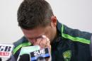 Australian cricket captain Michael Clarke wipes away a tear while making a statement at the Sydney Cricket Ground following the death of Australian cricket player Phil Hughes in Sydney, Saturday, Nov. 29, 2014. Hughes was 63 not out when he was struck by the ball on Tuesday, and that number has become symbolic in the tributes. (AP Photo/Rick Rycroft)