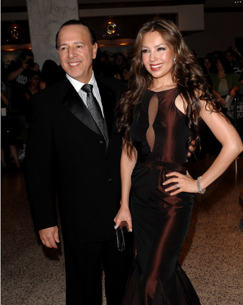 FILE - This May 9, 2009 file photo shows music mogul Tommy Mottola, left, and his wife, singer Thalia, at the 2009 White House Correspondents' Dinner in Washington. A decade after leaving Sony Music Entertainment, Tommy Mottola tells his story in a new book, "Hitmaker: The Man and His Music." (AP Photo/Evan Agostini, file)