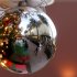 In this Thursday, Dec. 20, 2012, photo, a holiday shoppers reflected in a ornament handing from a large Christmas tree at Fashion Island shopping center in Newport Beach, Calif. Thursday, Dec. 20, 2012. U.S. holiday retail sales this year are the weakest since 2008, after a shopping season disrupted by storms and rising uncertainty among consumers.  A report out Tuesday that tracks spending, called MasterCard Advisors SpendingPulse, says holiday sales increased 0.7 percent. Analysts had expected sales to grow 3 to 4 percent. (AP Photo/Chris Carlson)