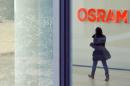 A woman walks in the headquarters of lamp manufacturer Osram in Munich