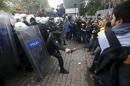 Demonstrators are stopped by the police during a protest against Saturday's Ankara bombings, in Istanbul
