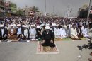 Followers of radical Shiite cleric Muqtada al-Sadr attend Friday prayers in the Sadr City neighborhood in Baghdad, Iraq, Friday, April 5, 2013. (AP Photo/Karim Kadim)