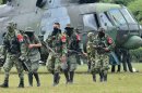 Demobilized members of the ELN (National Liberation Army) arrive in Cali, Colombia on July 16, 2013