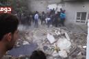 In this image taken from Monday, Nov. 4, 2013, video obtained from the Shaam News Network, which has been authenticated based on its contents and other AP reporting, people clear debris while searching for bodies in Douma, Syria. Activists said an air attack caused the ruin. (AP Photo/Shaam News Network via AP Video)