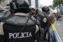 Venezuelan riot police arrest an opposition student taking part in an anti-government protest in Caracas on May 8, 2014