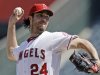 FILE - In this Sept. 27, 2012, file photo, Los Angeles Angels starter Dan Haren pitches to the Seattle Mariners in the second inning of a baseball game in Anaheim, Calif. A person familiar with the talks tells The Associated Press on Tuesday, Dec. 4, 2012, that the free agent pitcher and the Washington Nationals are close to completing a one-year deal for $13 million. (AP Photo/Reed Saxon, File)