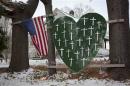 A heart is emblazoned with crosses to commemorate the 26 Sandy Hook Elementary School shooting victims in Sandy Hook village in Newtown