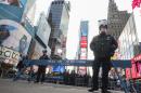 New York City police officers stand guard in Times Square during New Year's Eve celebrations in New York