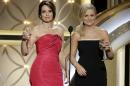 This image released by NBC shows hosts Tina Fey, left, and Amy Poehler during the 71st annual Golden Globe Awards at the Beverly Hilton Hotel on Sunday, Jan. 12, 2014, in Beverly Hills, Calif. (AP Photo/NBC, Paul Drinkwater)