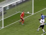 Italy's Balotelli scores a second goal against Germany's goalkeeper Neuer during their Euro 2012 semi-final soccer match at the National stadium in Warsaw