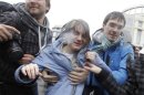 Samutsevich, a member of the female punk band "Pussy Riot", walks after she was freed from the court room in Moscow