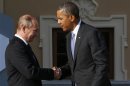 Russia's President Putin welcomes U.S. President Obama before the first working session of the G20 Summit in Constantine Palace in Strelna near St. Petersburg