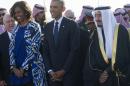Saudi King Salman (R) walks alongside US President Barack Obama (C) and First Lady Michelle Obama at King Khalid International Airport in Riyadh on January 27, 2015