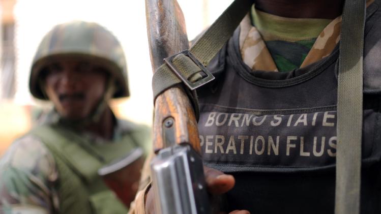 Nigerian soldiers of "Operation Flush", an offensive against Islamist militants, stand in a military camp in Maiduguri on June 6, 2013